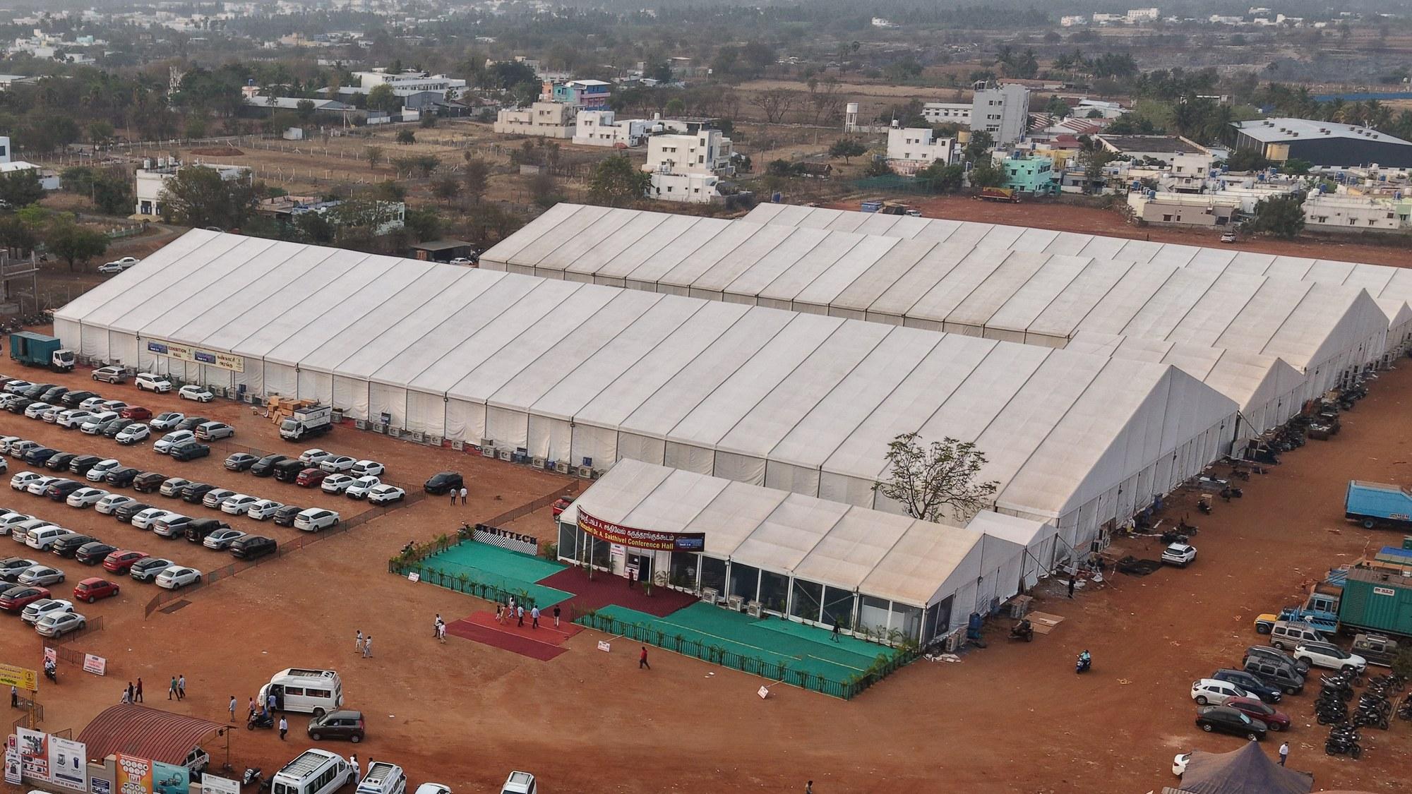 Aerial drone view of the Hi-Tech Tirupur Exhibition Centre — all halls aligned, Knit-Tech 2026.