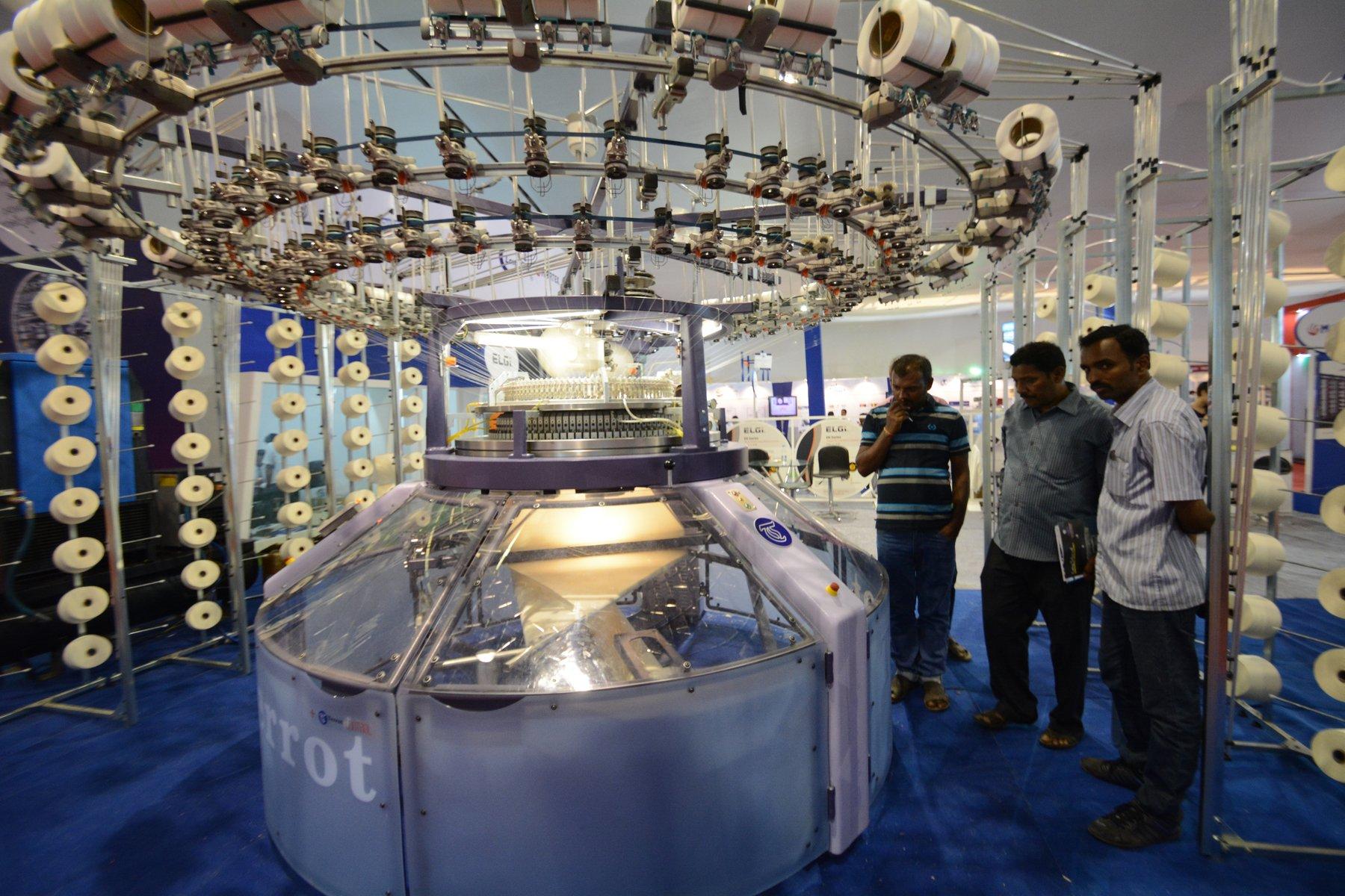 A circular knitting machine on display.